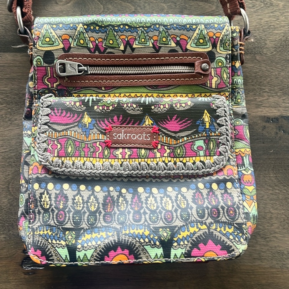 Sakroots crossbody bag- excellent condition used once.  Approx. 9” x 8”